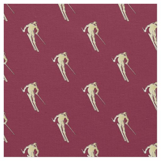 Gold skier on red fabric