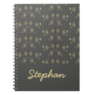 Gold snowflakes on gray notebook