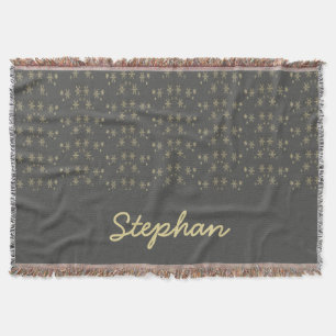 Gold snowflakes on gray throw blanket