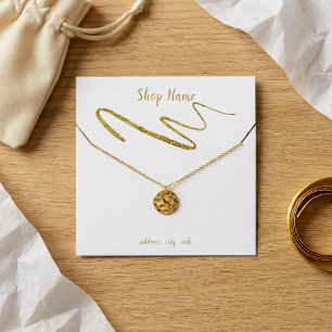 Gold sparkly squiggle necklace display card