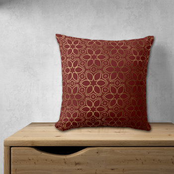 Gold Starflower Pattern On Maroon Red Throw Pillow by AvenueCentral at Zazzle