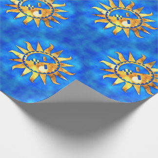 Gold suns on blue water wrapping paper