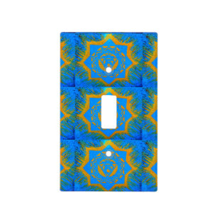 gold tantric design on blue light switch cover