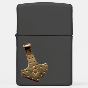 Gold Thor Hammer resting black Zippo Lighter