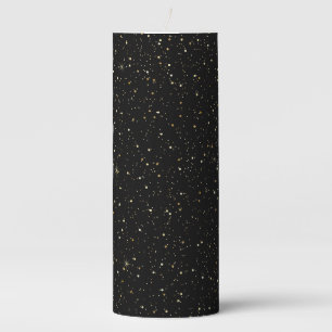 Gold tone glitter and sparkles on black pillar candle