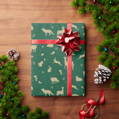 Gold woodland animals silhouettes on green wrapping paper