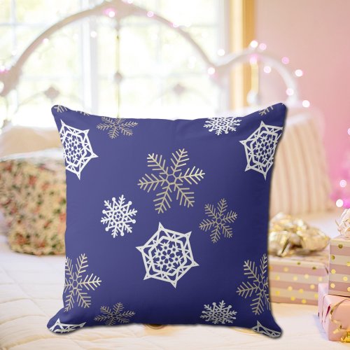 golden and white snowflakes against midnight blue throw pillow