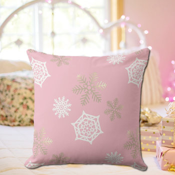 Golden And White Snowflakes Against Pale Pink Outdoor Pillow by almawad at Zazzle