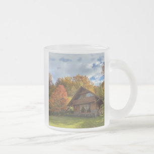 golden autumn, wooden house in the mountains frosted glass coffee mug