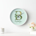 Golden Branches Foliage Greenery Letter B Monogram Clock<br><div class="desc">Looking for a personalized and stylish addition to your collection? Look no further than our Golden Branches Foliage Greenery Custom Text Letter B Monogram design, exclusively available on Zazzle! Featuring elegant watercolor letter in a beautiful gold and shades of moss and green paint, this design is the perfect way to...</div>