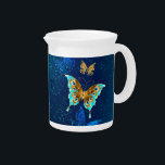 Golden Butterflies on a Blue Background Beverage Pitcher<br><div class="desc">Flying gold,  jewelry butterfly on blue textural background. Design with butterflies.</div>