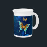 Golden Butterflies on a Blue Background Beverage Pitcher<br><div class="desc">Flying gold,  jewelry butterfly on blue textural background. Design with butterflies.</div>