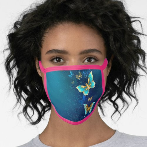 Golden Butterflies on a Blue Background Face Mask