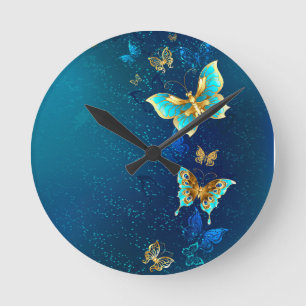 Golden Butterflies on a Blue Background Round Clock
