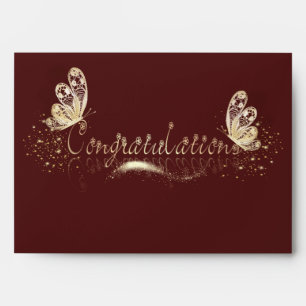 golden butterflies with congratulations envelope