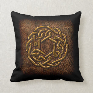 Golden celtic knot on leather throw pillow