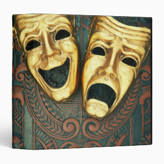 Golden comedy and tragedy masks on patterned binder