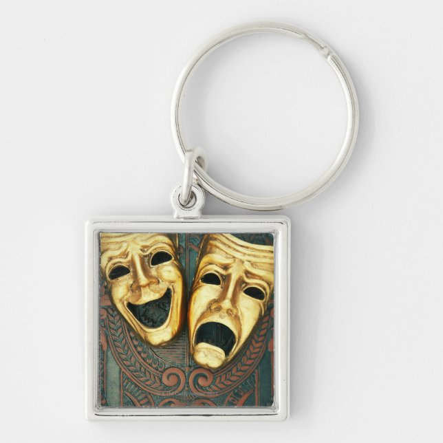 Golden comedy and tragedy masks on patterned keychain (Front)