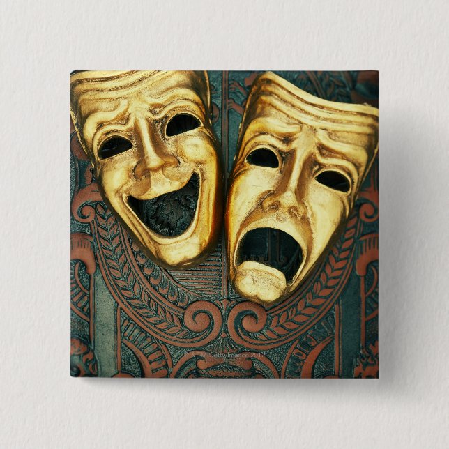 Golden comedy and tragedy masks on patterned pinback button (Front)