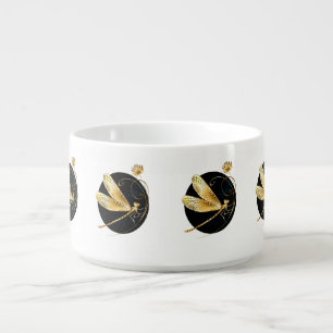 Golden dragonfly in black circle bowl