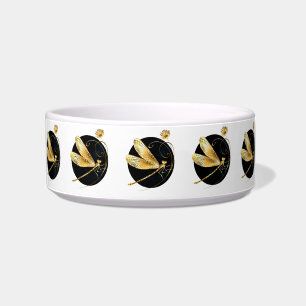 Golden dragonfly in black circle bowl