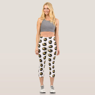 Golden dragonfly in black circle capri leggings