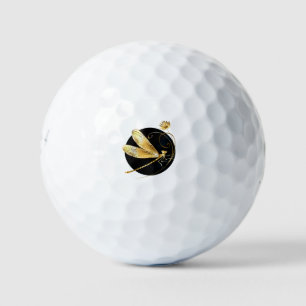 Golden dragonfly in black circle golf balls