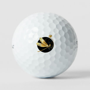 Golden dragonfly in black circle golf balls