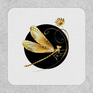 Golden dragonfly in black circle patch