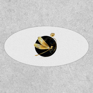 Golden dragonfly in black circle patch