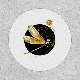 Golden dragonfly in black circle patch