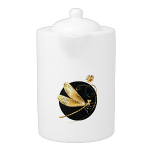 Golden dragonfly in black circle teapot