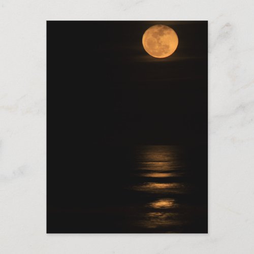 golden full moon over ocean postcard