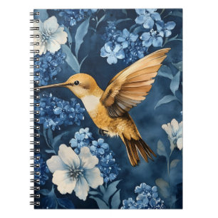 golden hummingbird flying amidst blue and white  notebook