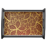 Golden leaf lace on red background serving tray