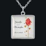 Golden Love Hearts and Red Wedding Sterling Silver Necklace<br><div class="desc">An elegant necklace to celebrate your nuptials featuring golden colored love hearts hanging behind a long stemmed red rose bud. The background is a subtle pattern of love hearts. The text is fully customizable for your own special occasion.</div>