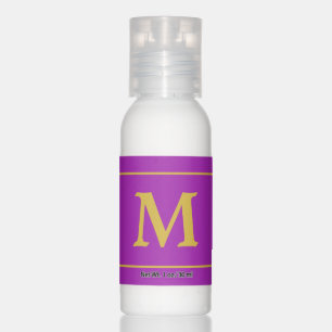 Golden monogram on royal purple hand lotion