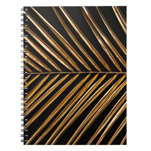 Golden painted date palm leaf closeup on abstract  notebook (Front)