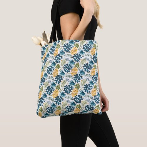 Golden pineapple blue palm leaves foliage white tote bag