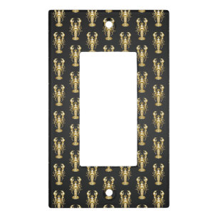 Golden polygonal lobster crawfish on black light switch cover