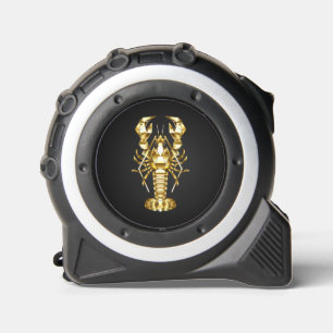 Golden polygonal lobster crawfish on black tape measure