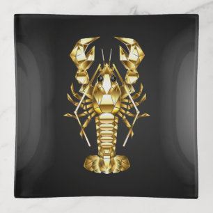 Golden polygonal lobster crawfish on black trinket tray