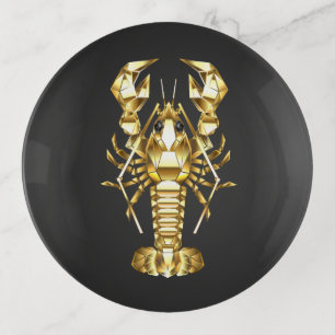 Golden polygonal lobster crawfish on black trinket tray
