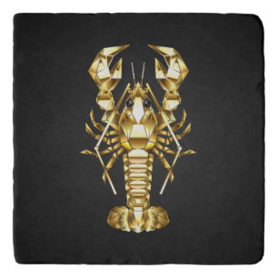Golden polygonal lobster crawfish on black trivet