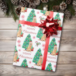 Golden Retriever Christmas Pattern Wrapping Paper<br><div class="desc">What a pretty wrapping paper for anyone who loves a Golden Retriever! The dog wears a red and white Santa hat, and sits in front of a decorated Holiday tree. The image is repeated across the surface, and there are red snowflakes and striped candy canes between the images. There is...</div>