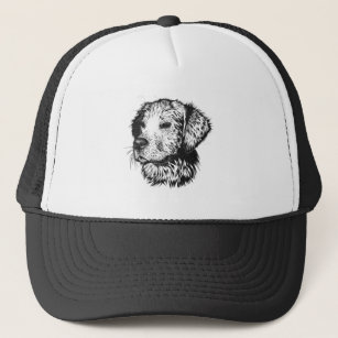 Golden retriever puppy portrait in black and white trucker hat