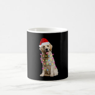 golden retriever sitting with christmas coffee mug