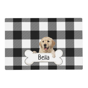 Golden retriever with bone and plaid placemat