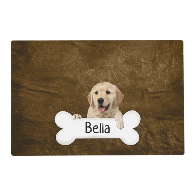 Golden retriever with bone on leather placemat (Front)