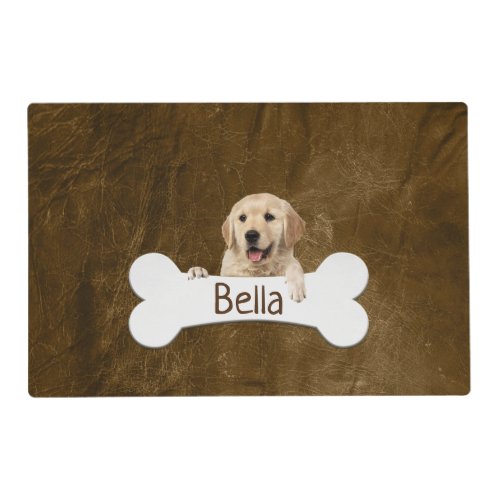 Golden retriever with bone on leather placemat